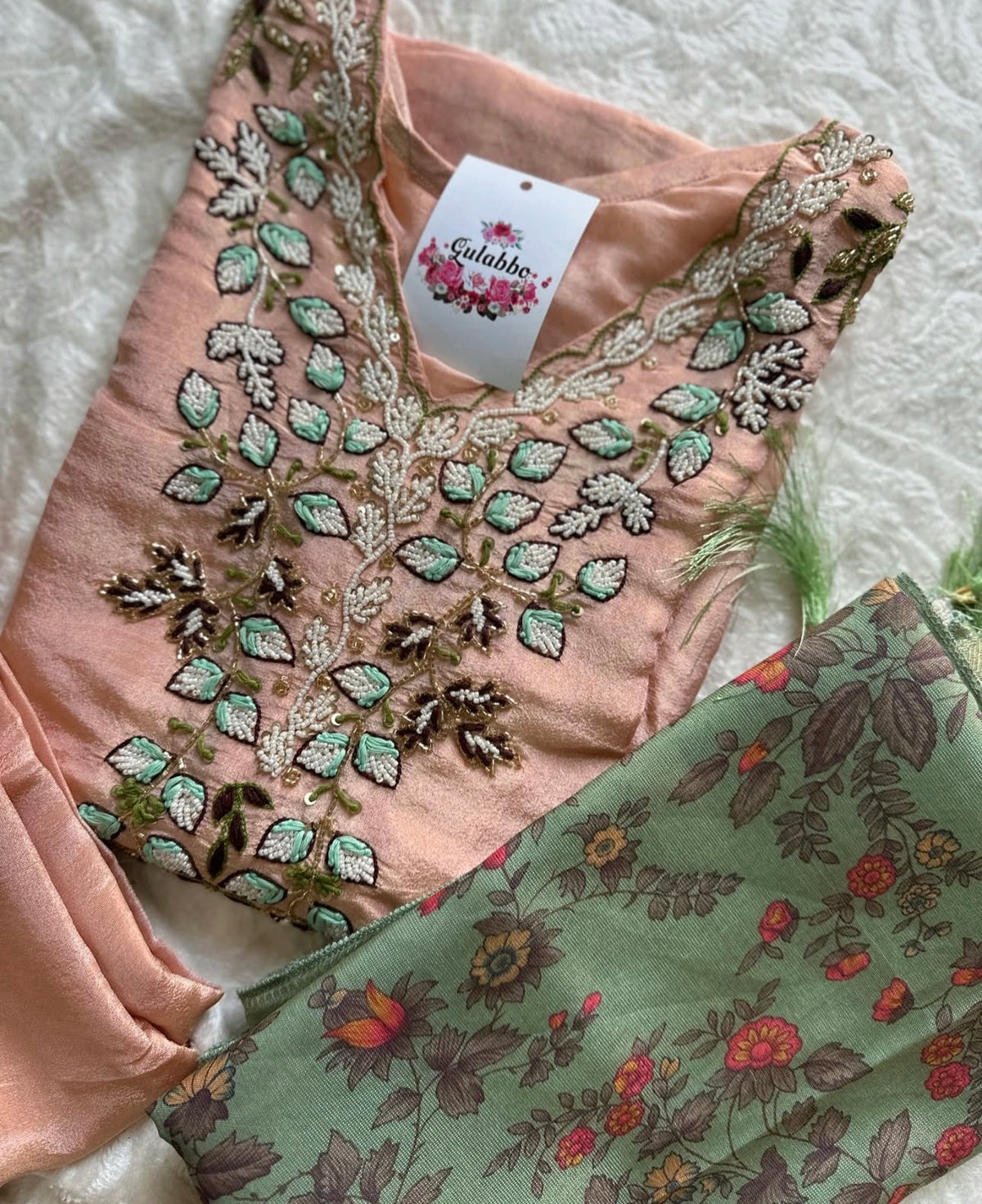Vibrant floral embroidery with a coordinating floral dupatta.