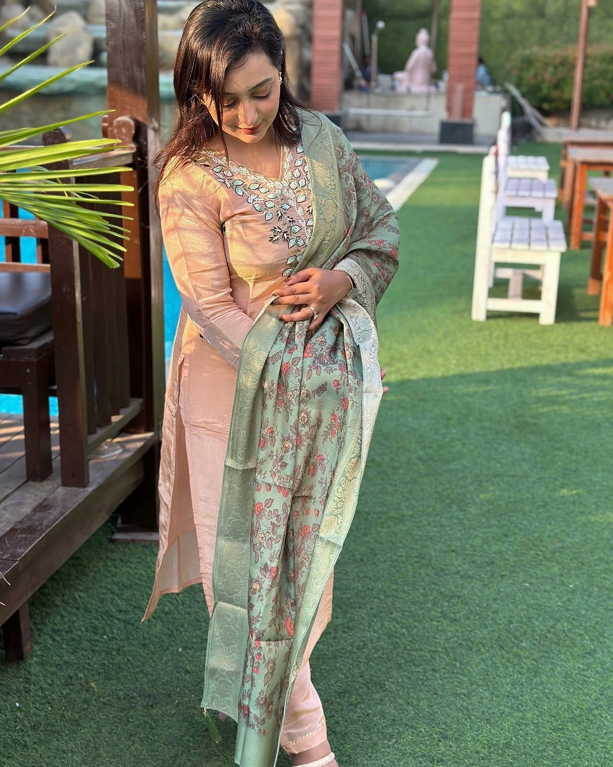 Vibrant floral embroidery with a coordinating floral dupatta.